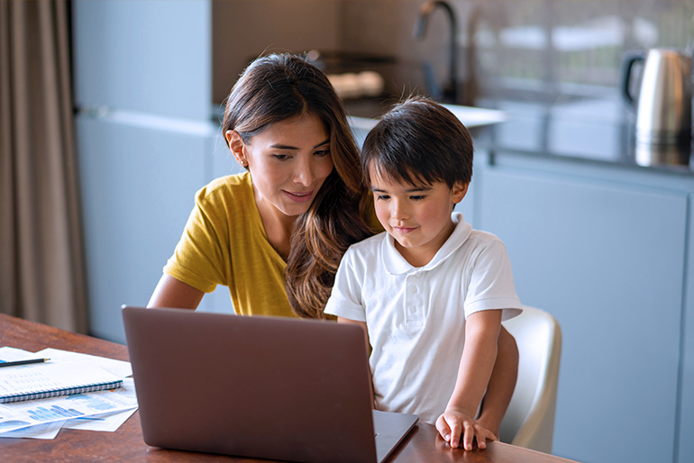 mother and child using a laptop