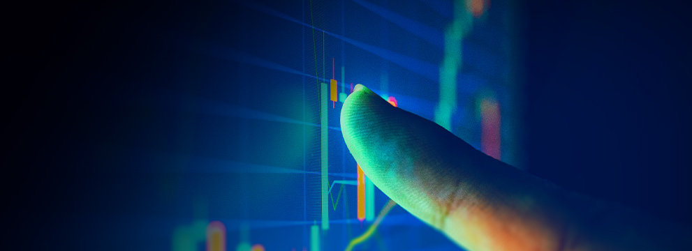 finger pointing at interest rates on screen