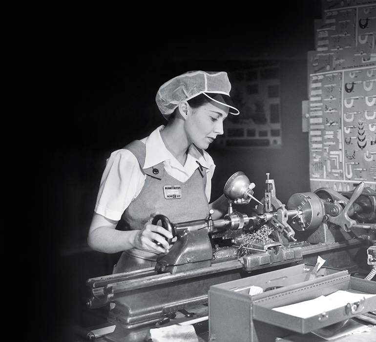 historical photo of woman working in factory